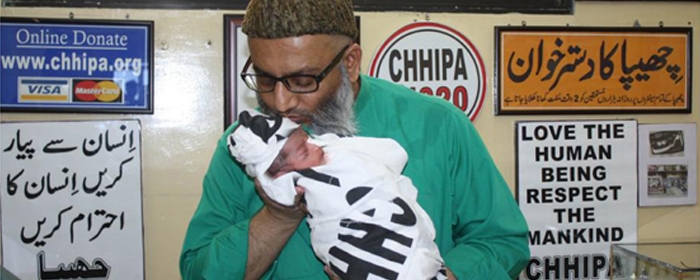 Social Worker Ramzan Chhipa holds an unwanted child with profound affection